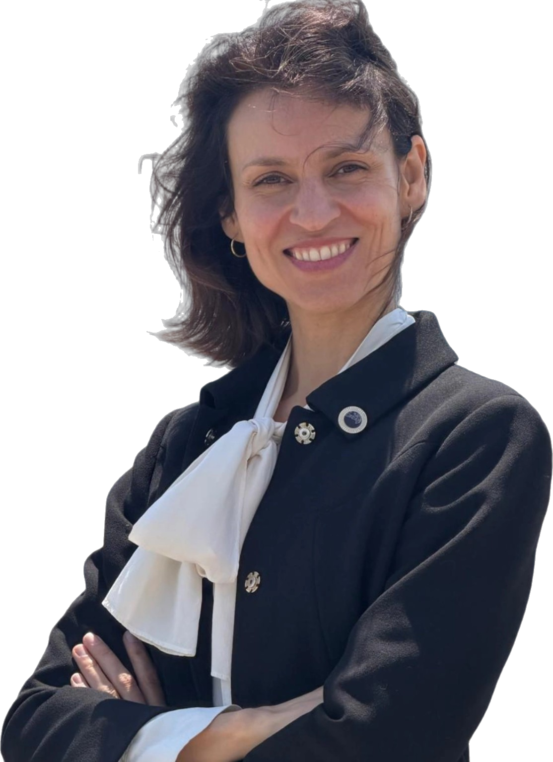 Alexandra Caldwell, candidate for Ward 1 Town Councillor, standing with arms crossed
